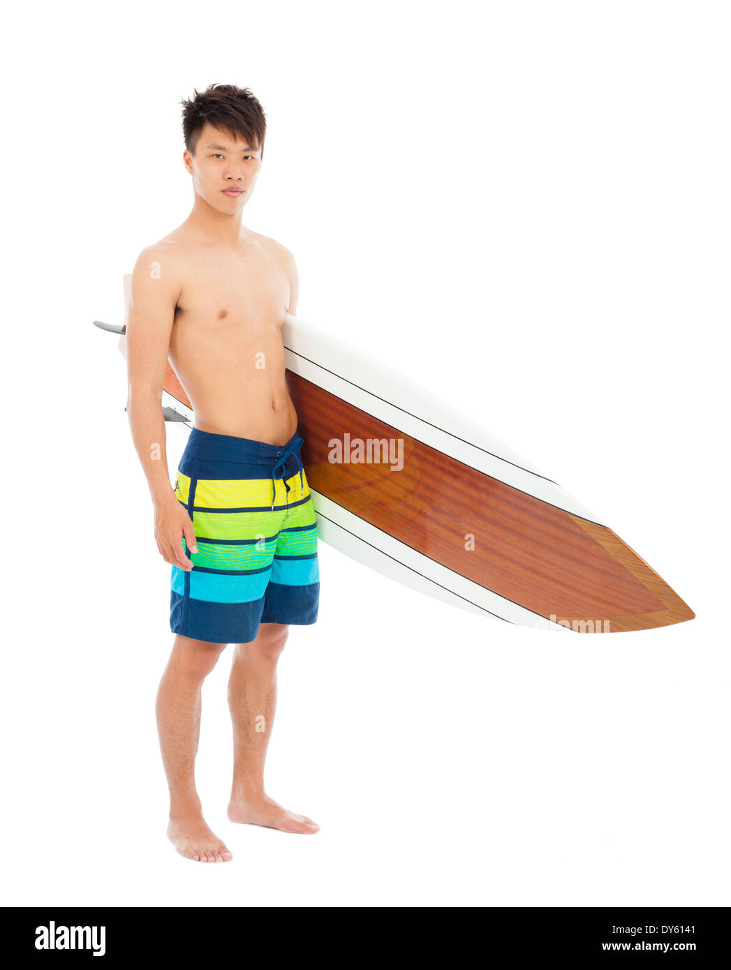 young boy holding a surfboard over white background Stock Photo