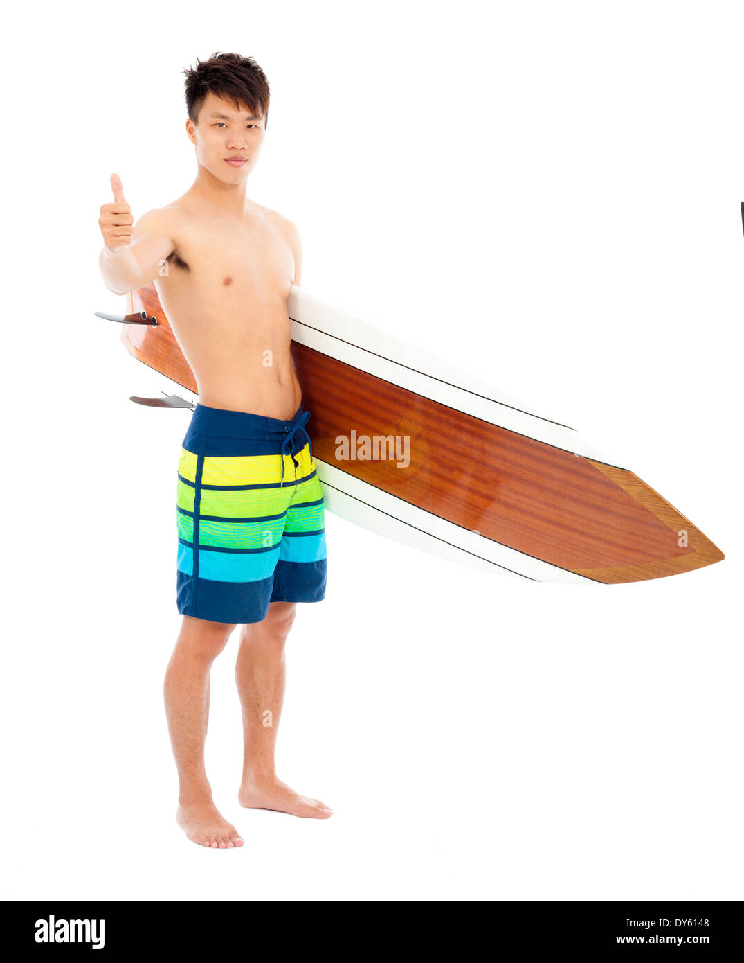 surfer holding a surfboard and thumb up Stock Photo