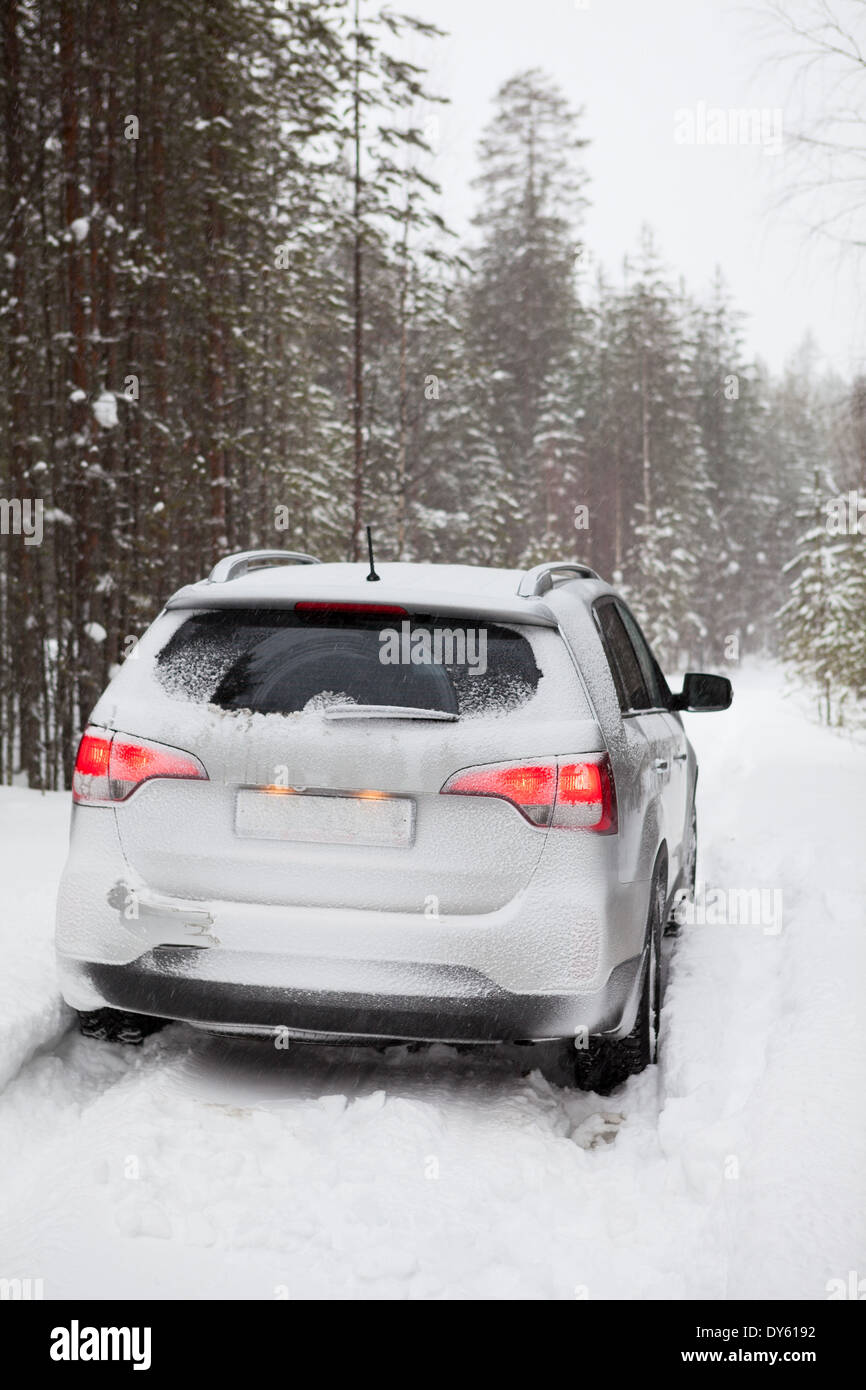 Car on a snowy road, rear view Stock Photo