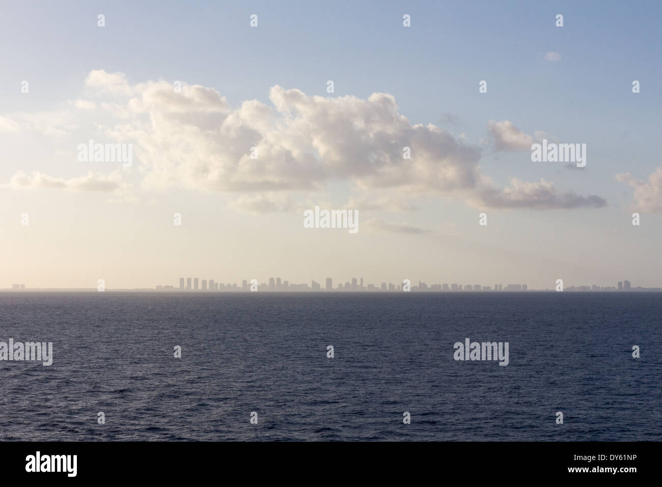 Distant city skyline on the horizon at sea Stock Photo - Alamy