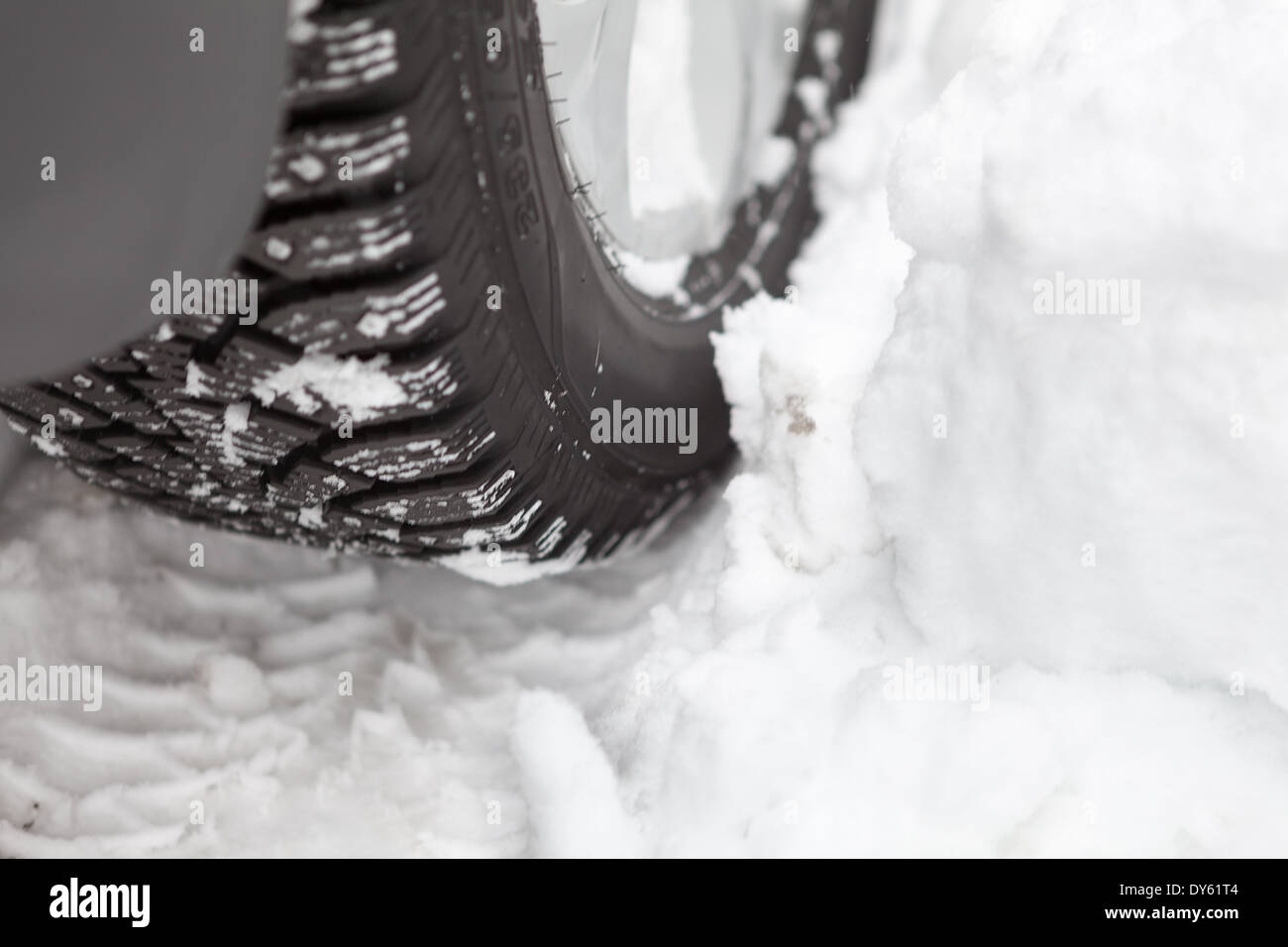Wheel of the car with winter tires in the snow Stock Photo Alamy