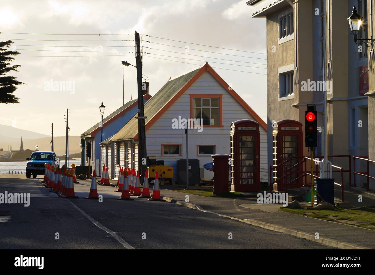 Post office, red telephone boxes, cones and traffic light, waterfront