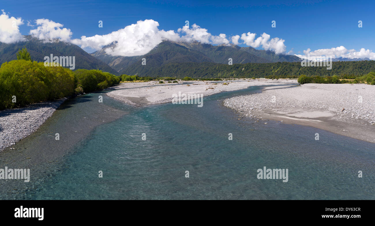 Panoramic view looking upstream the Wanganui River from the Highway 6 bridge, West Coast, New Zealand. Stock Photo