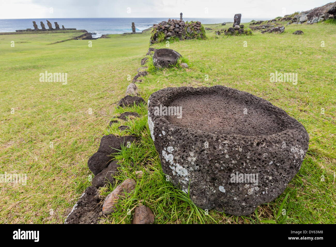 House foundation and sevem moai in the Tahai Archaeological Zone on Easter Island (Rapa Nui), UNESCO Site, Chile Stock Photo