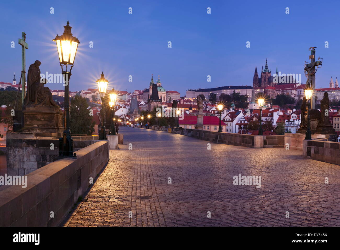 Illuminated Charles Bridge and Castle District with St. Vitus Cathedral and Royal Palace, UNESCO Site, Prague, Czech Republic Stock Photo