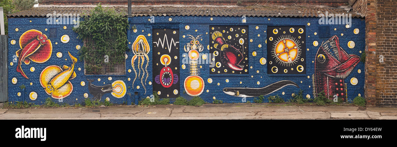 Mahalski's Electric Soup mural in London on a wall and old shop front at Orchard Place covers hides broken windows Stock Photo
