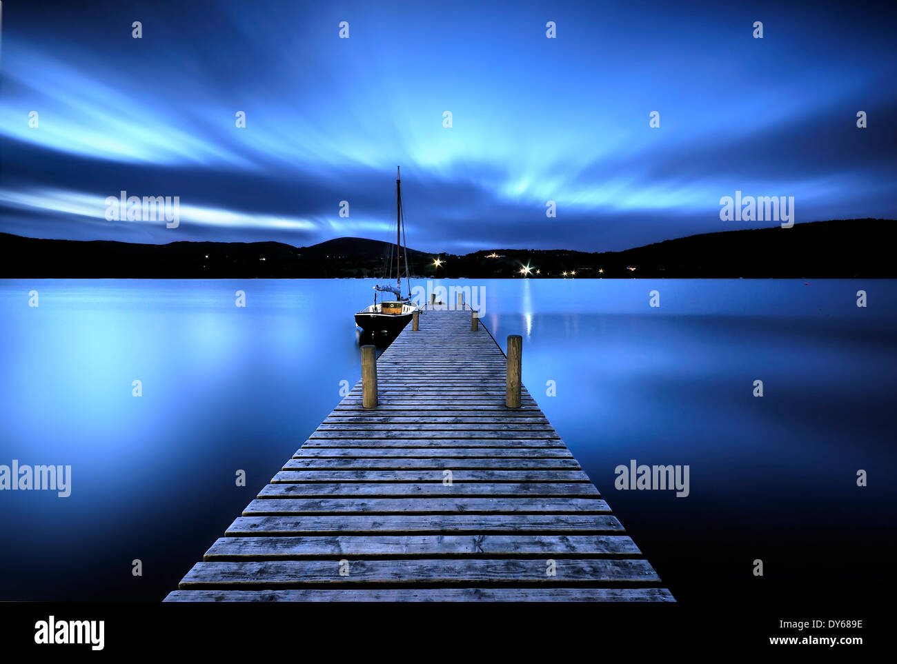 ullswater pier and boat at night in the lake district Stock Photo