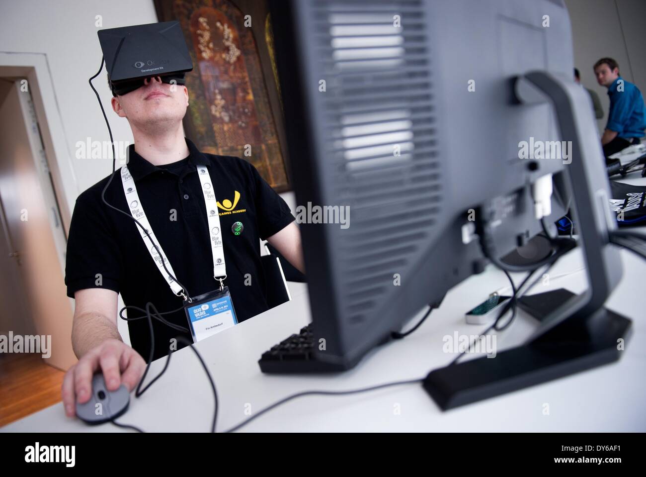 Berlin, Germany. 08th Apr, 2014. A man plays a game with the virtual reality head-mounted display 'Oculus Rift' at International Games Week in Berlin, Germany, 08 April 2014. The display transfers the eye movements to the game in real time. International Games Week Berlin takes place from 08 till 13 April 2014. Photo: DANIEL NAUPOLD/DPA/Alamy Live News Stock Photo