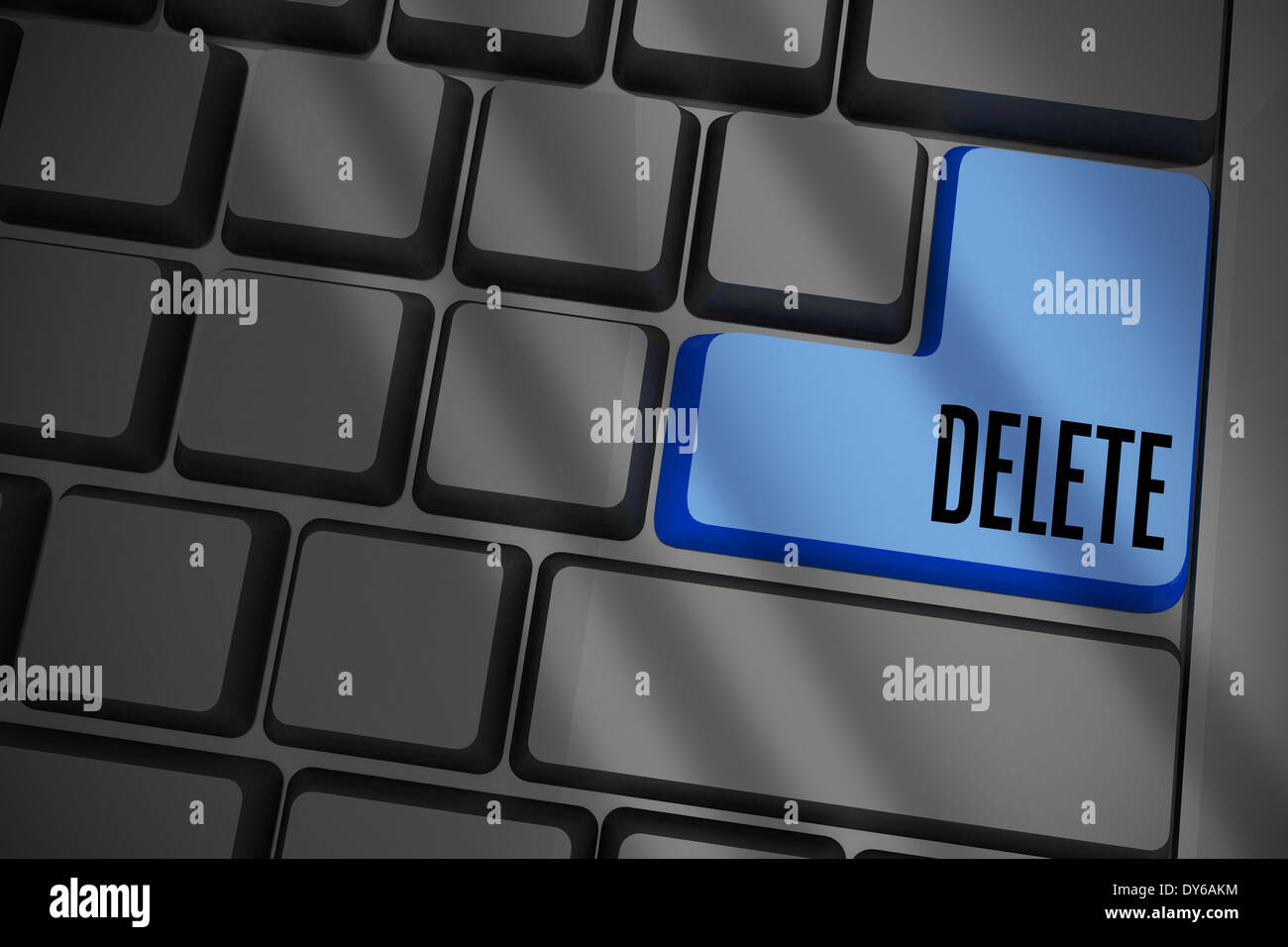 Delete on black keyboard with blue key Stock Photo