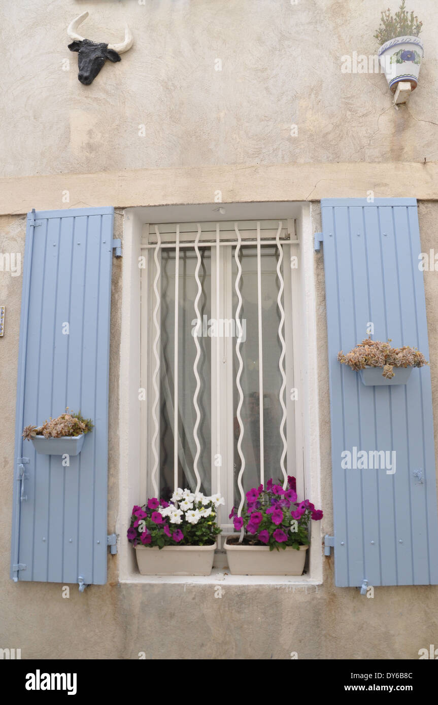 Pretty decorative window and shutters on a house in Saintes Maries de la Mer,  de Camargue, France Stock Photo