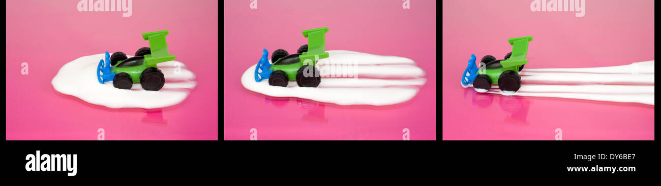 A trilogy of a toy car driving through yogurt on a pink surface Stock Photo