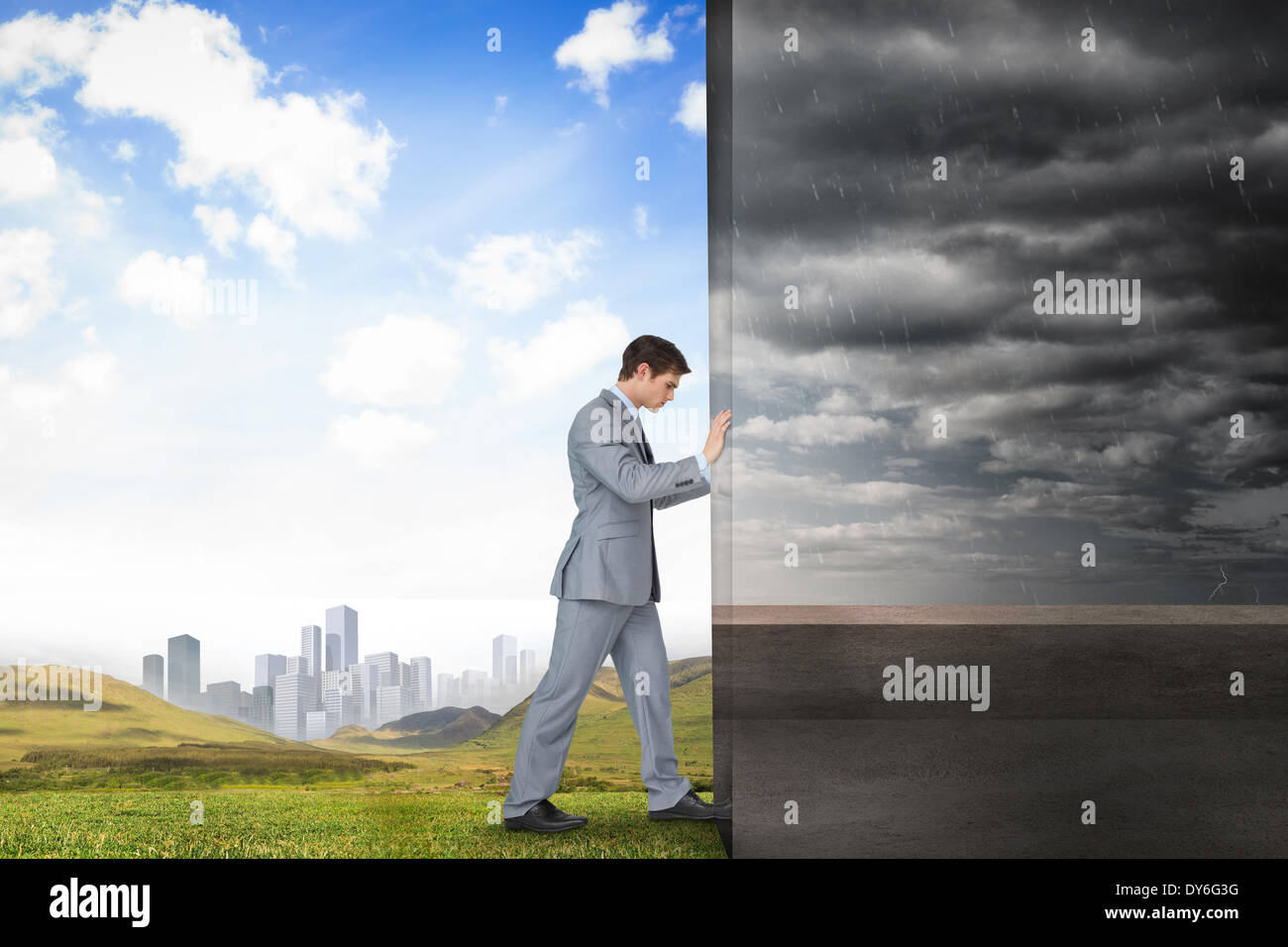 Composite image of businessman pushing away scene Stock Photo - Alamy