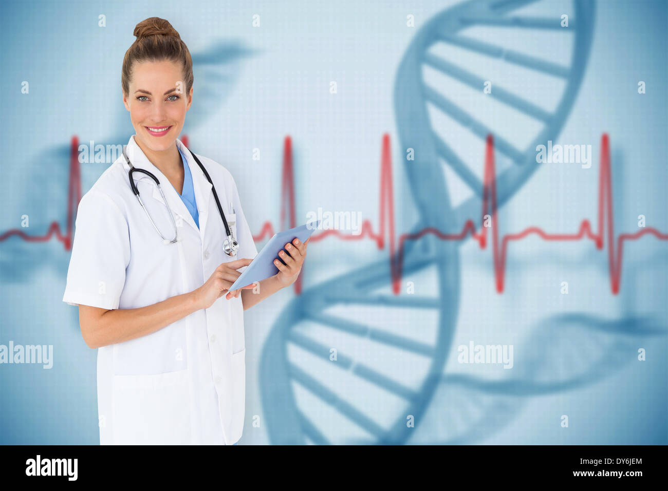 Composite image of pretty nurse using tablet pc Stock Photo