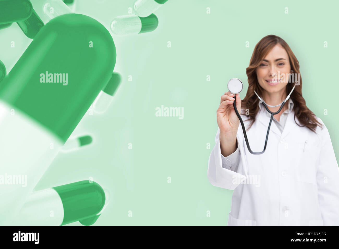 Composite image of happy doctor using stethoscope Stock Photo