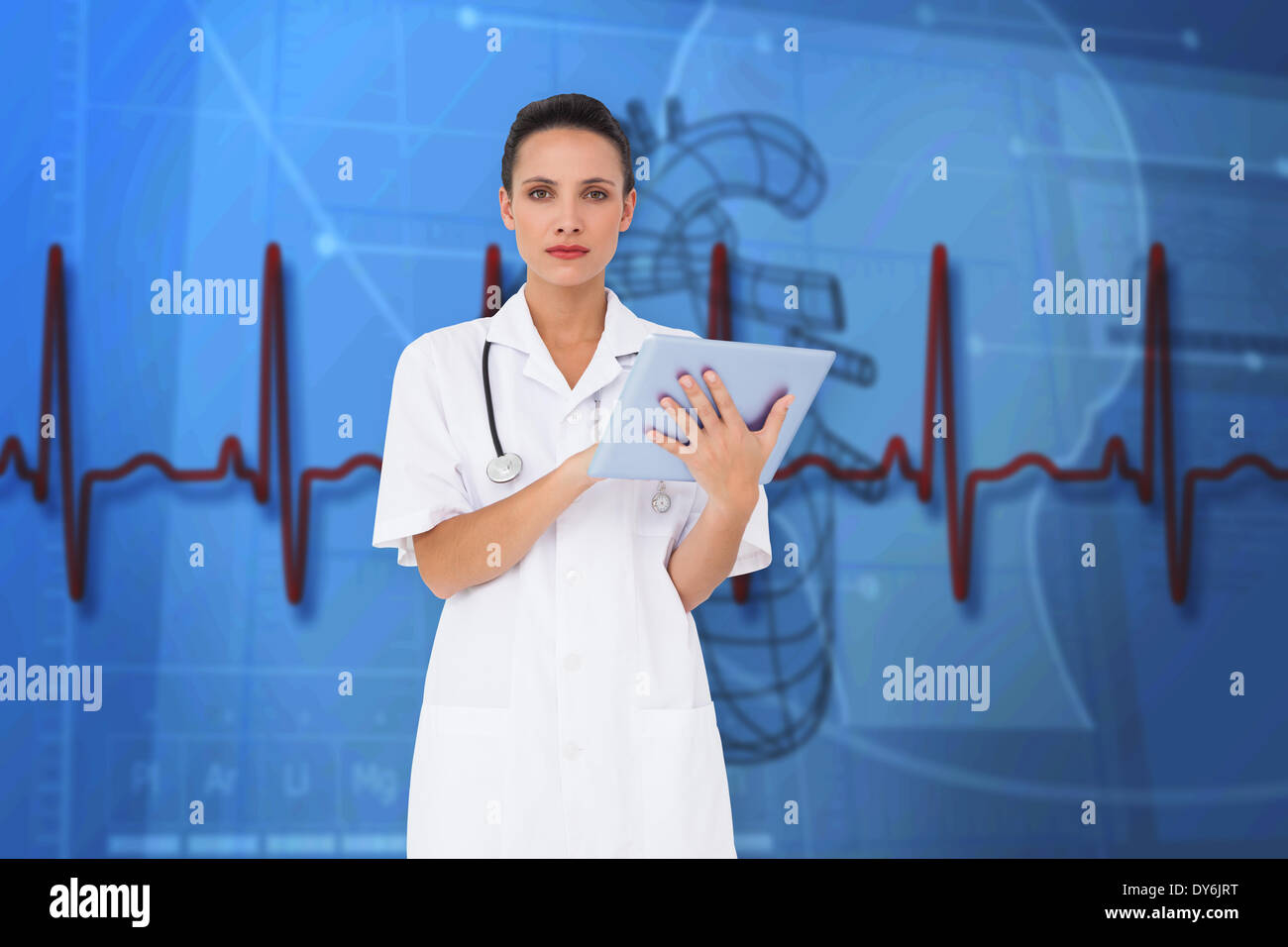 Composite image of pretty nurse using tablet pc Stock Photo