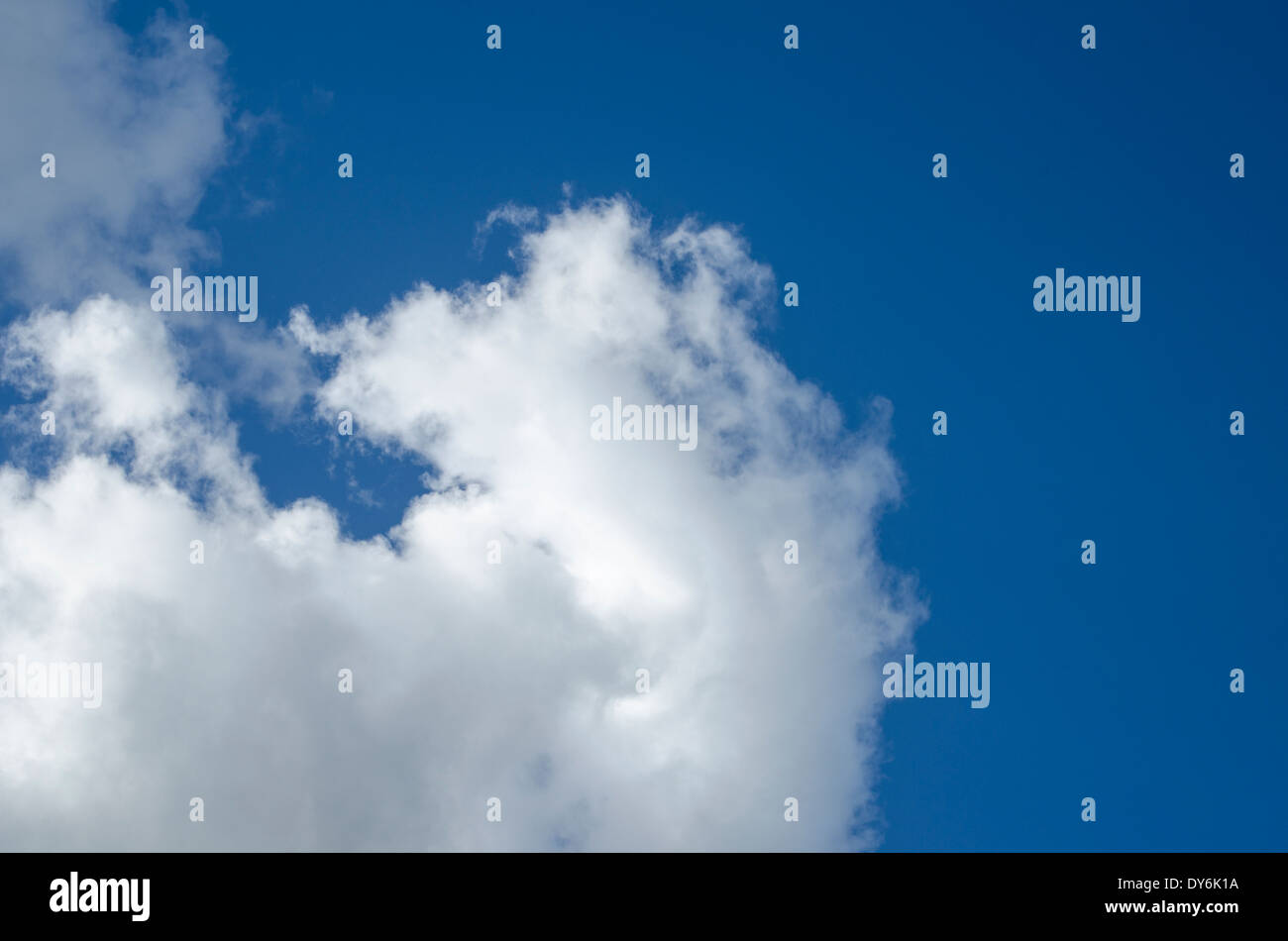 Blue sky with fluffy clouds Stock Photo - Alamy