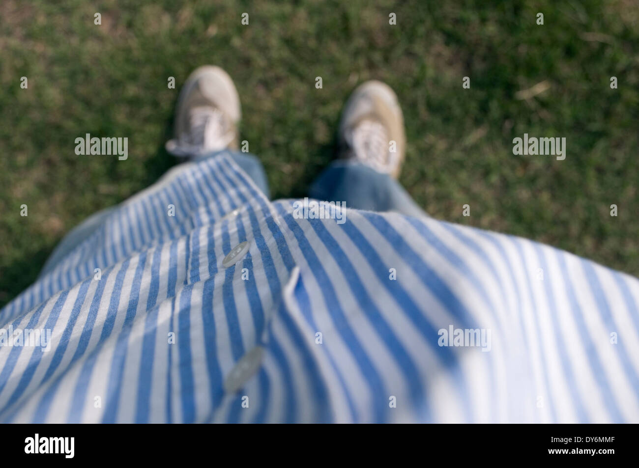 Downward view of striped shirt Stock Photo