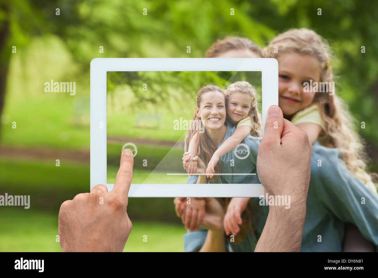 Composite image of hand holding tablet pc Stock Photo
