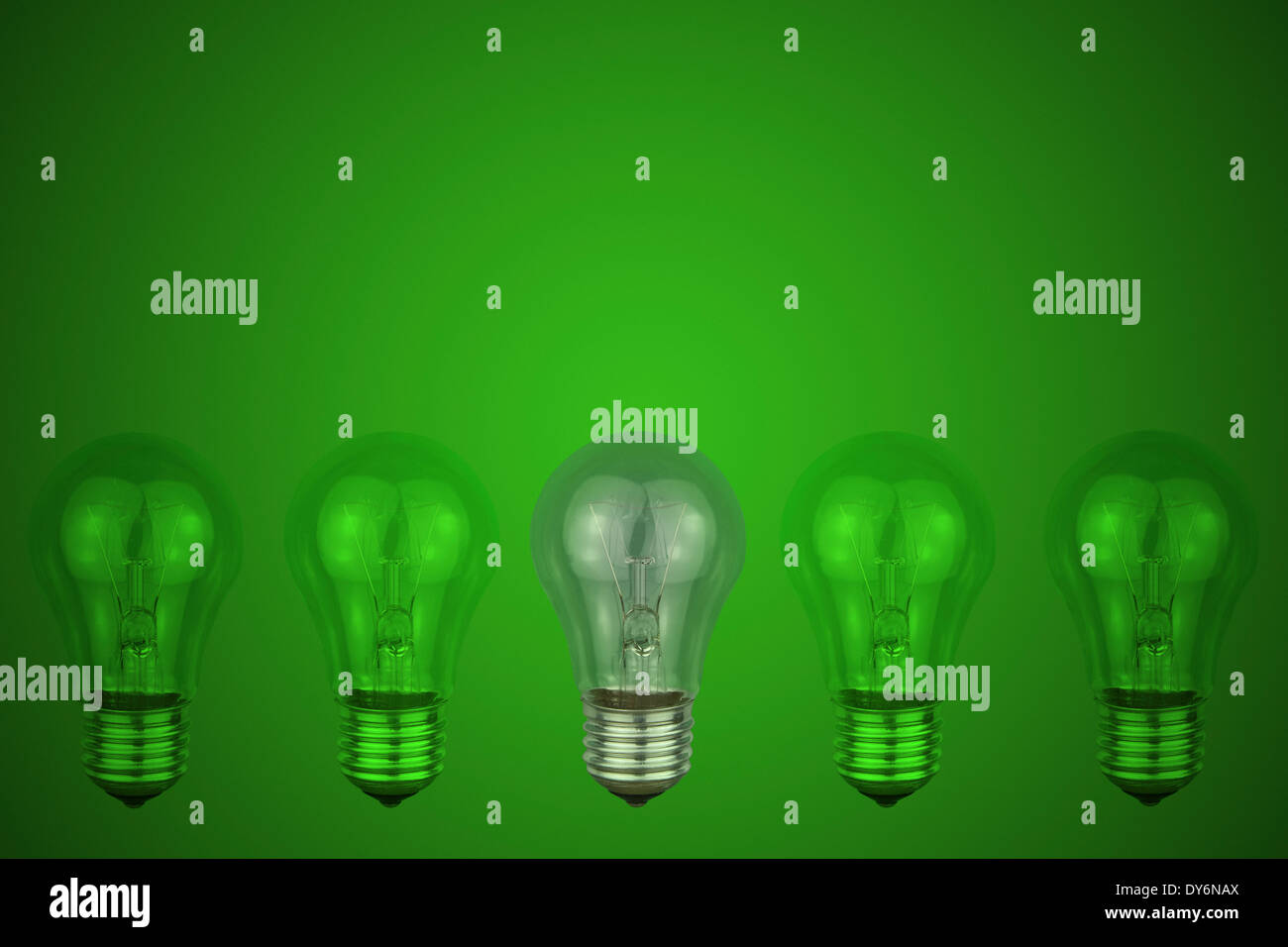 light bulb on a green background Stock Photo - Alamy