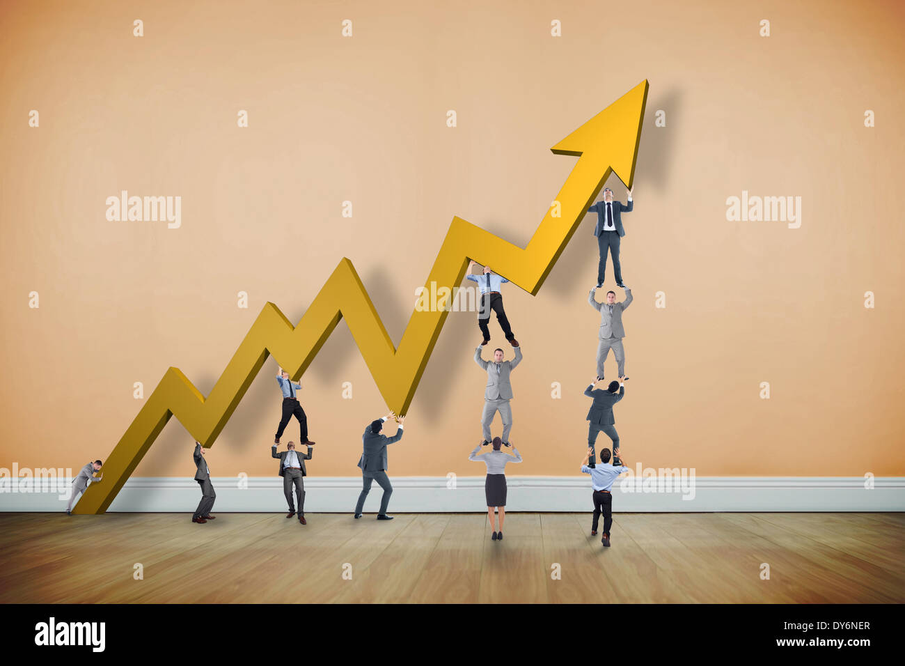 Composite image of business team holding up arrow Stock Photo - Alamy