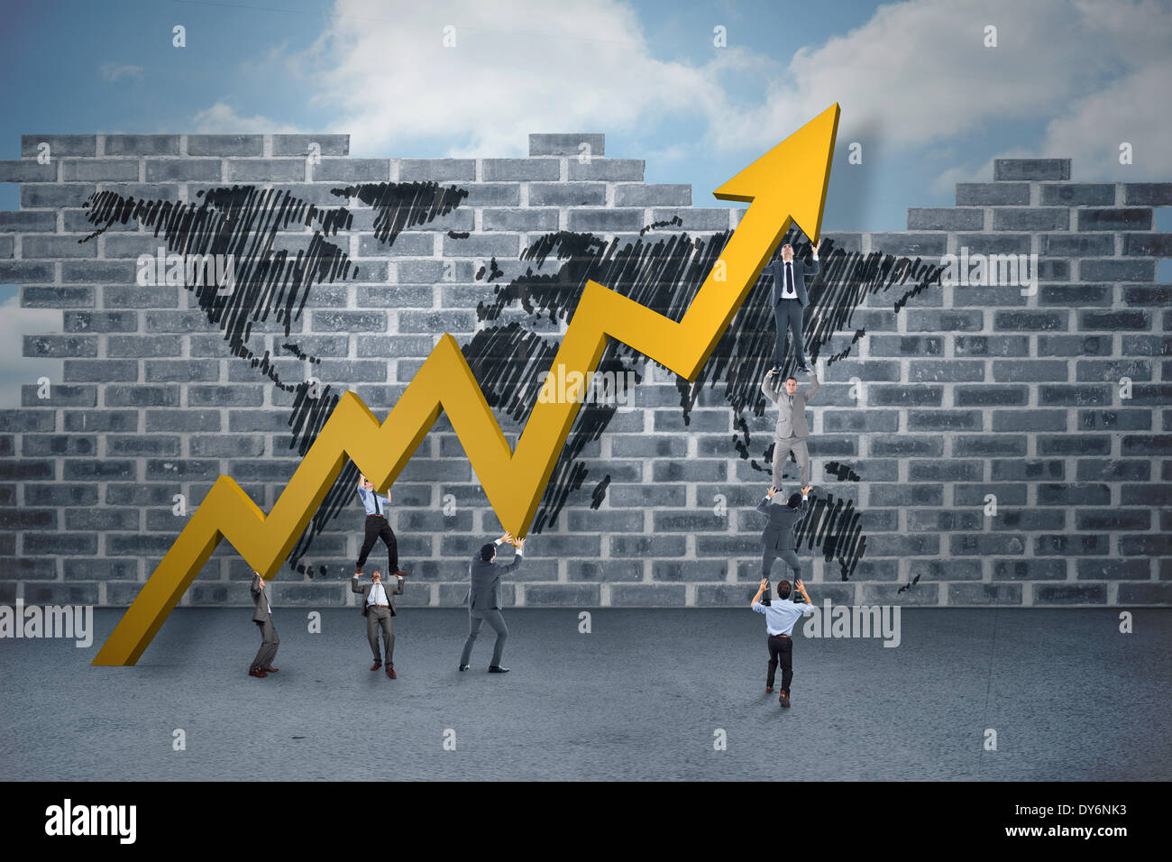 Composite image of business team holding up arrow Stock Photo - Alamy