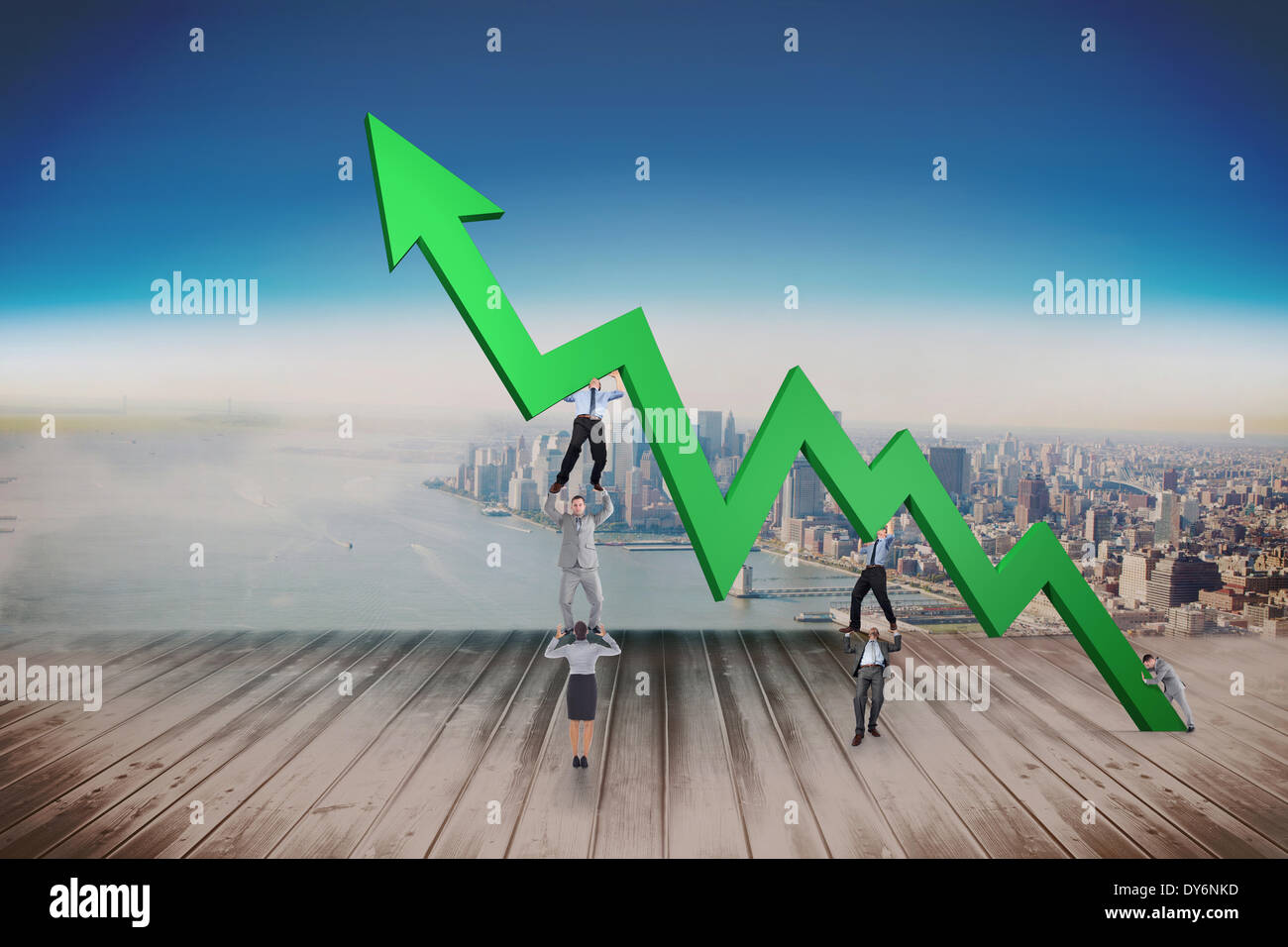 Composite image of business team holding up arrow Stock Photo - Alamy