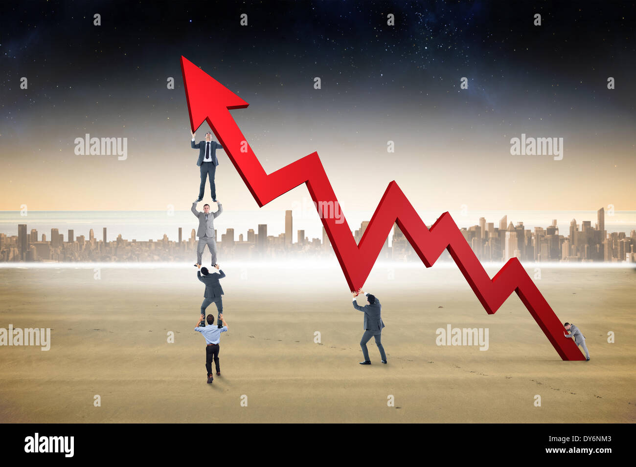 Composite image of business team holding up arrow Stock Photo - Alamy