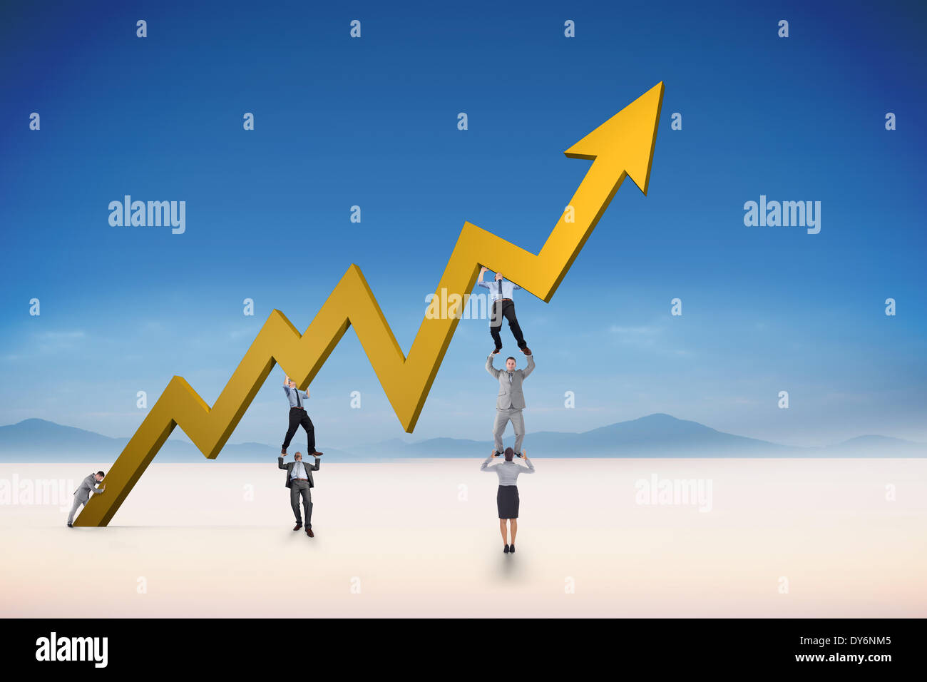Composite image of business team holding up arrow Stock Photo - Alamy