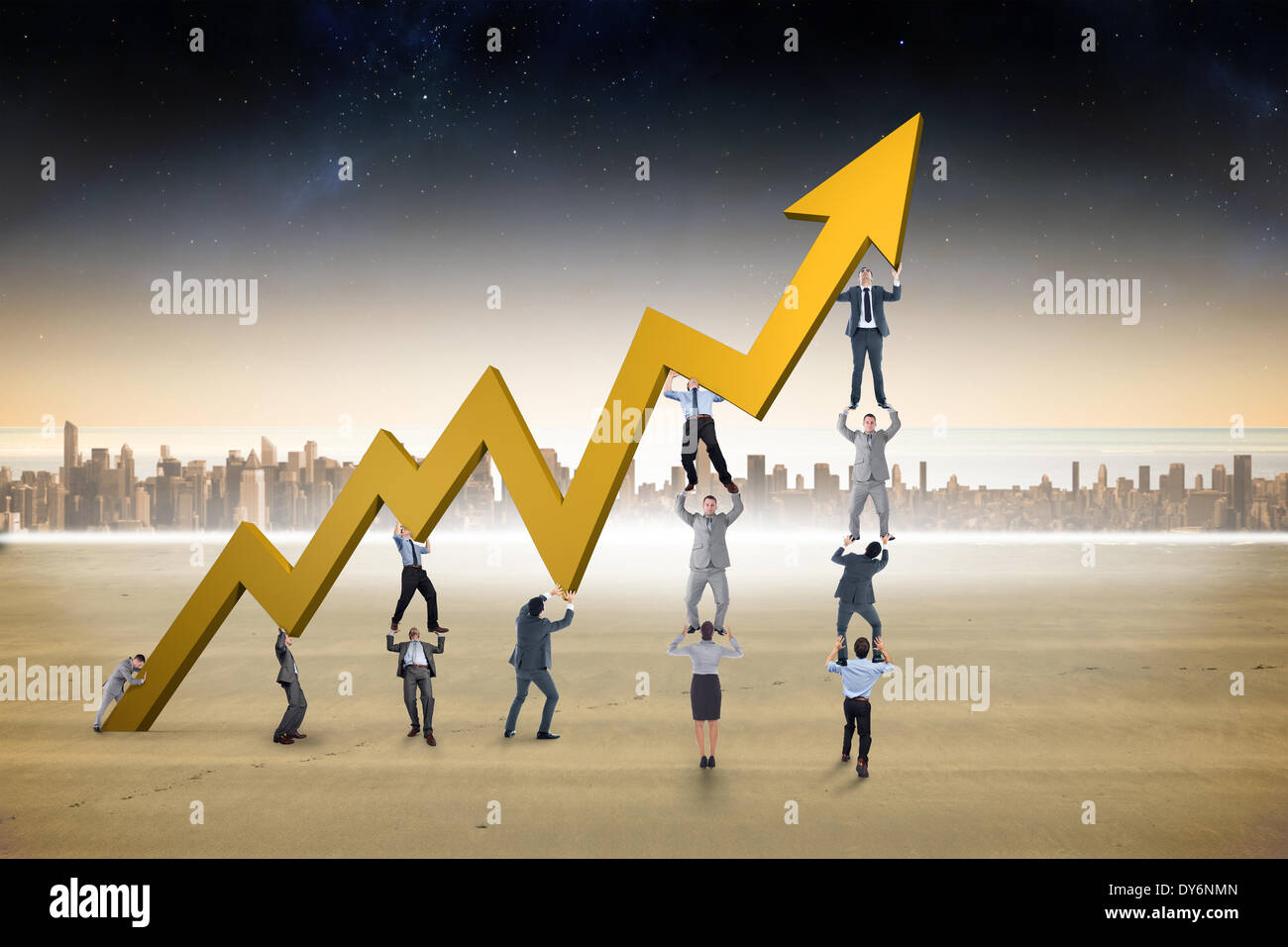 Composite image of business team holding up arrow Stock Photo - Alamy
