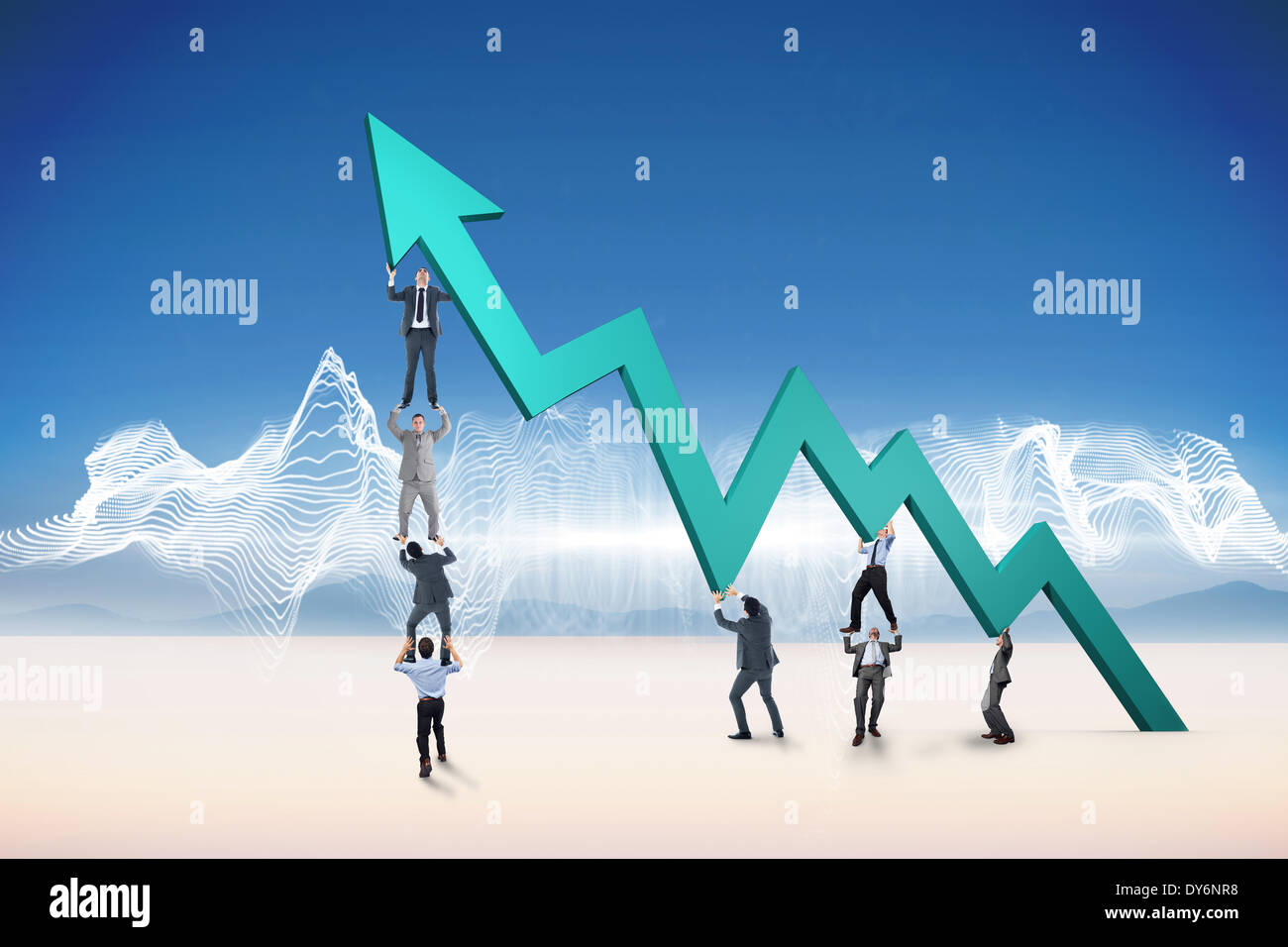 Composite image of business team holding up arrow Stock Photo - Alamy