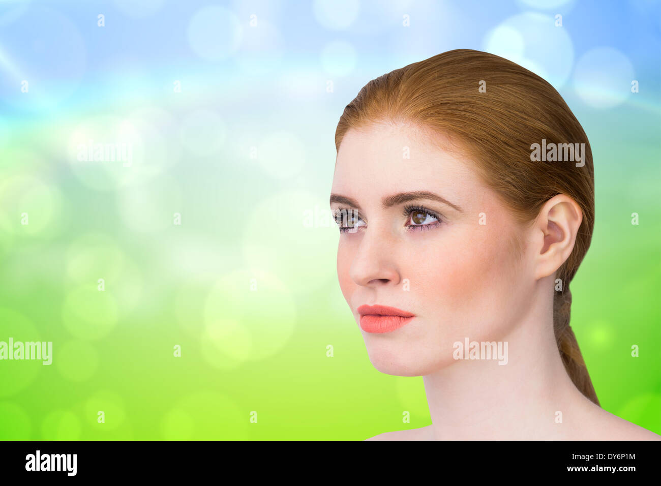 Composite image of beautiful redhead posing with hair tied Stock Photo