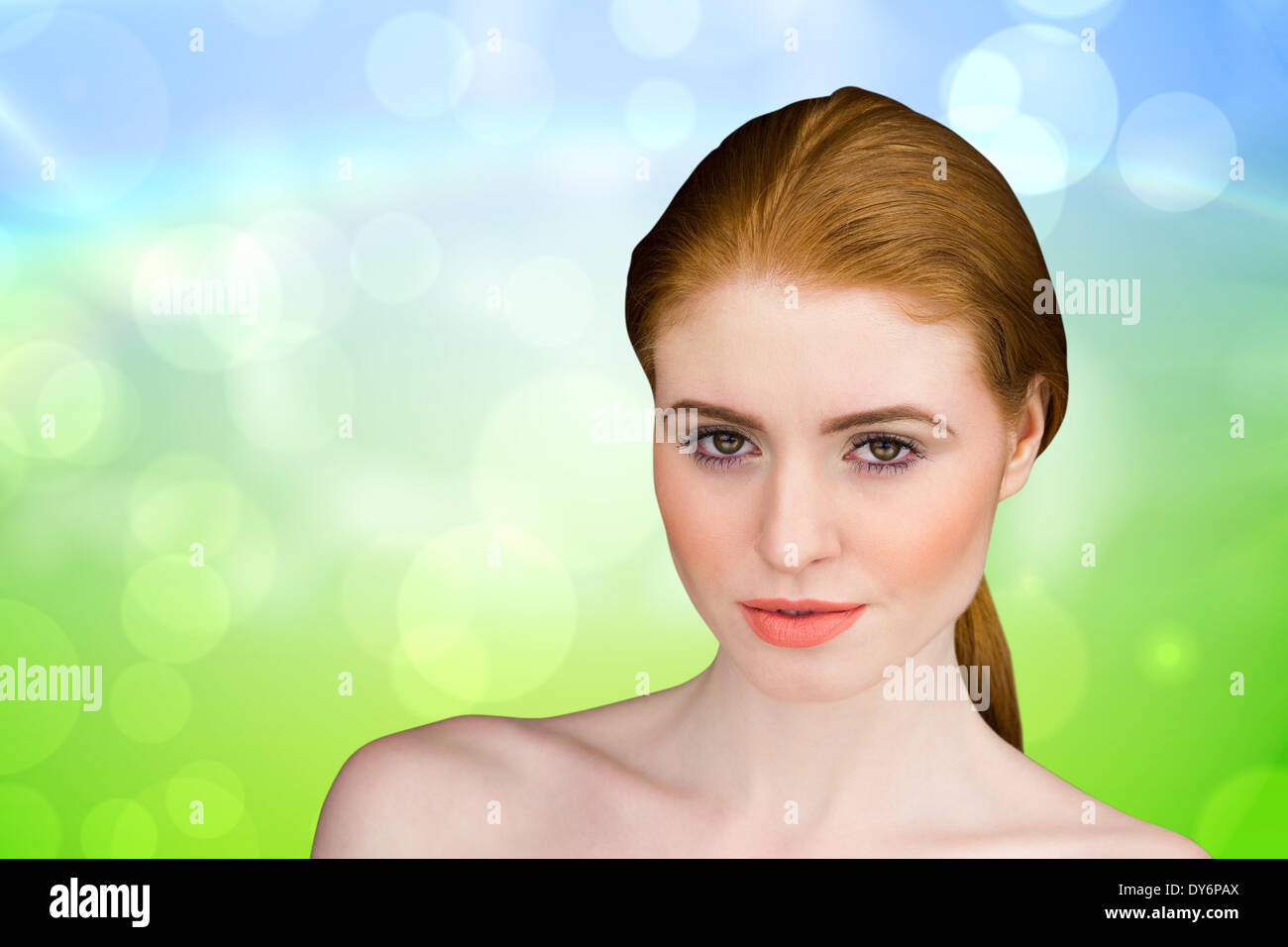 Composite image of beautiful redhead looking at camera Stock Photo