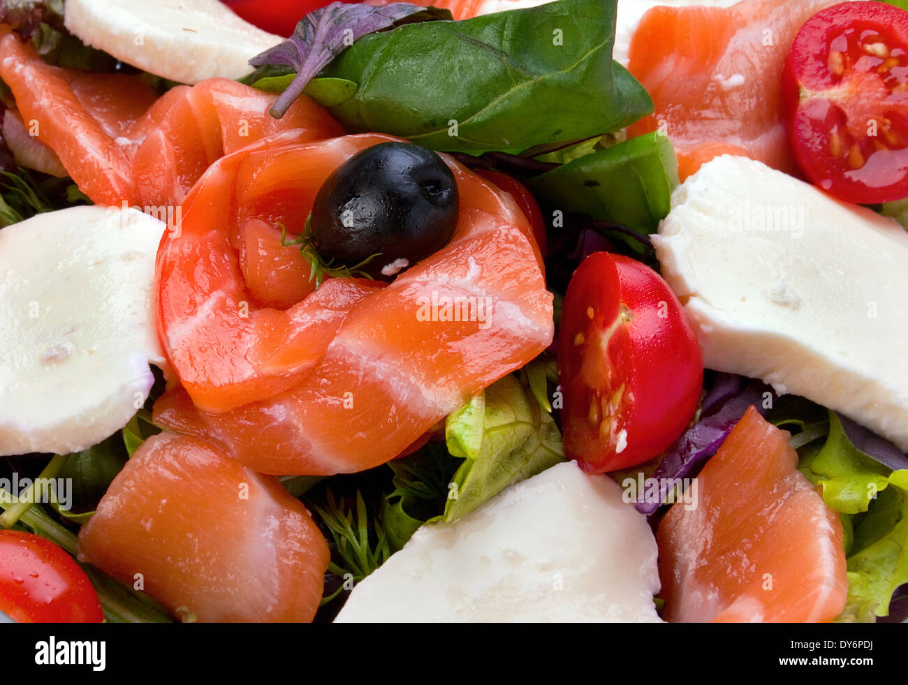 Salad with red fish salmon vegetable and feta cheese Stock Photo - Alamy