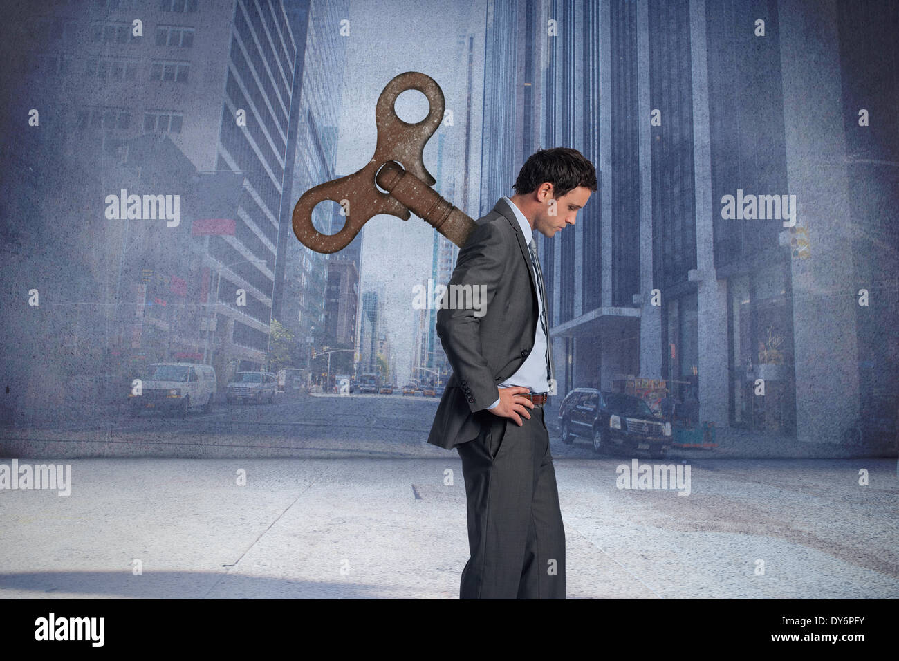 Composite image of wound up businessman with hands on hips Stock Photo