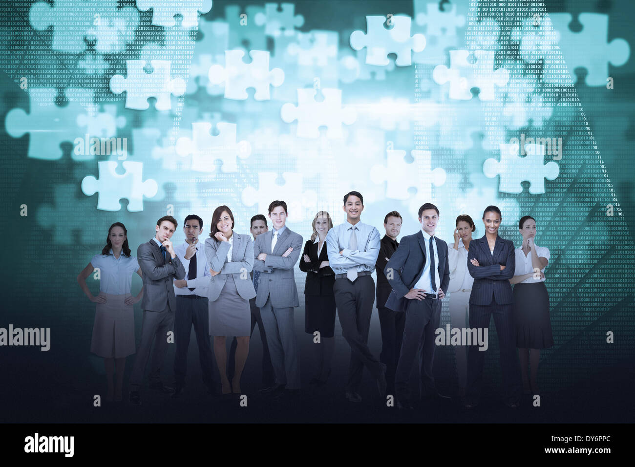 Business team against jigsaw background Stock Photo