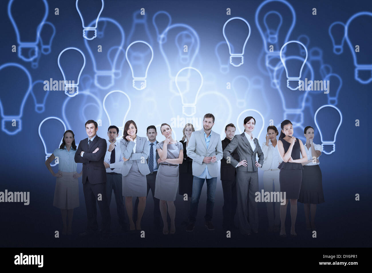 Business team against light bulb background Stock Photo