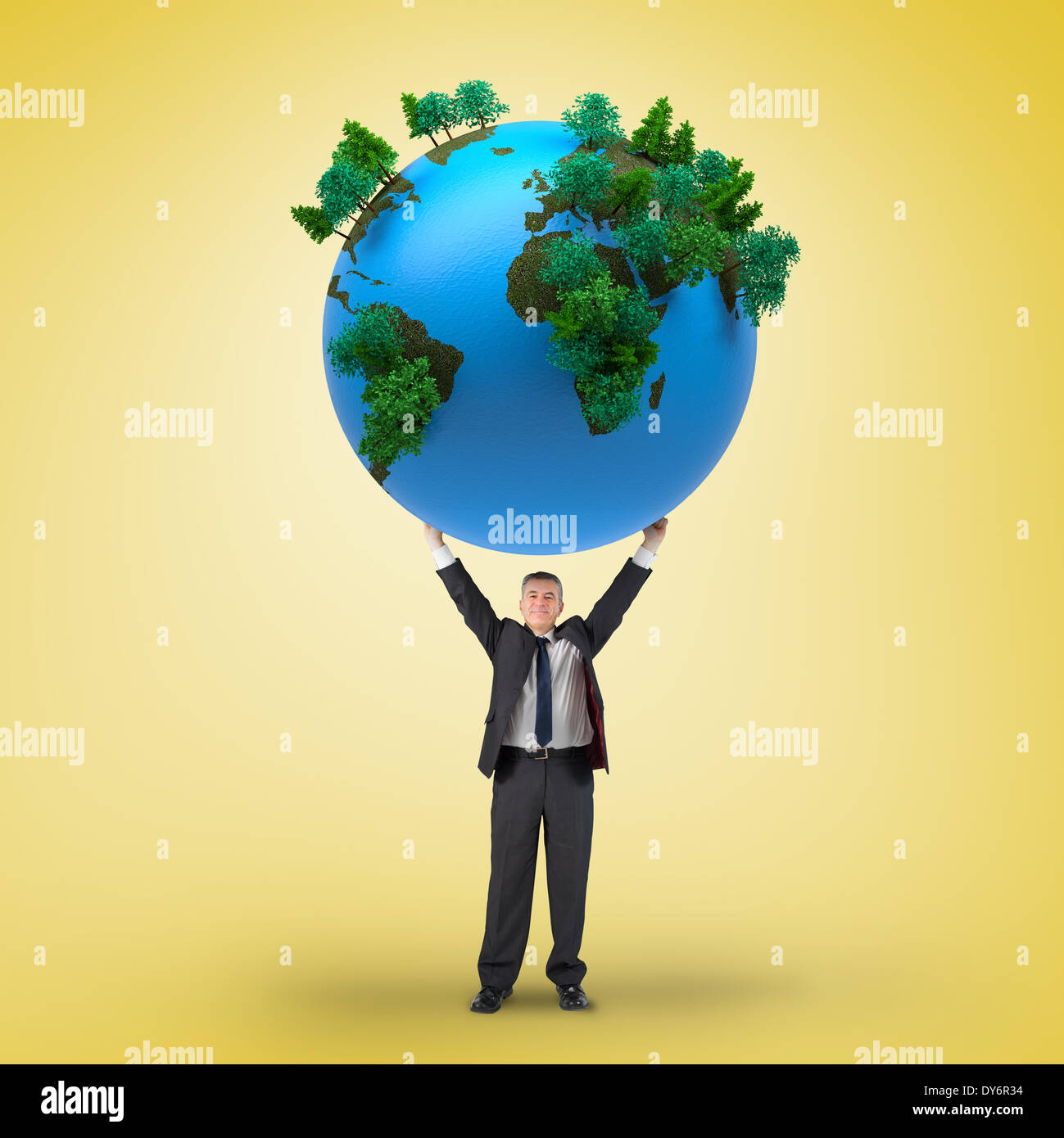 Composite image of businessman holding earth Stock Photo