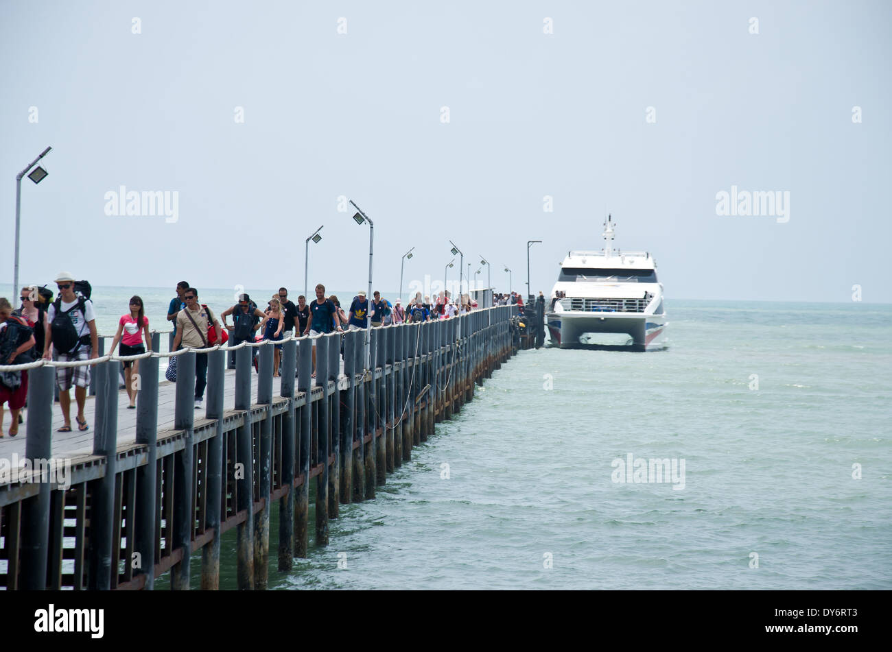 tourist travel from ferry to the land from bridge Stock Photo