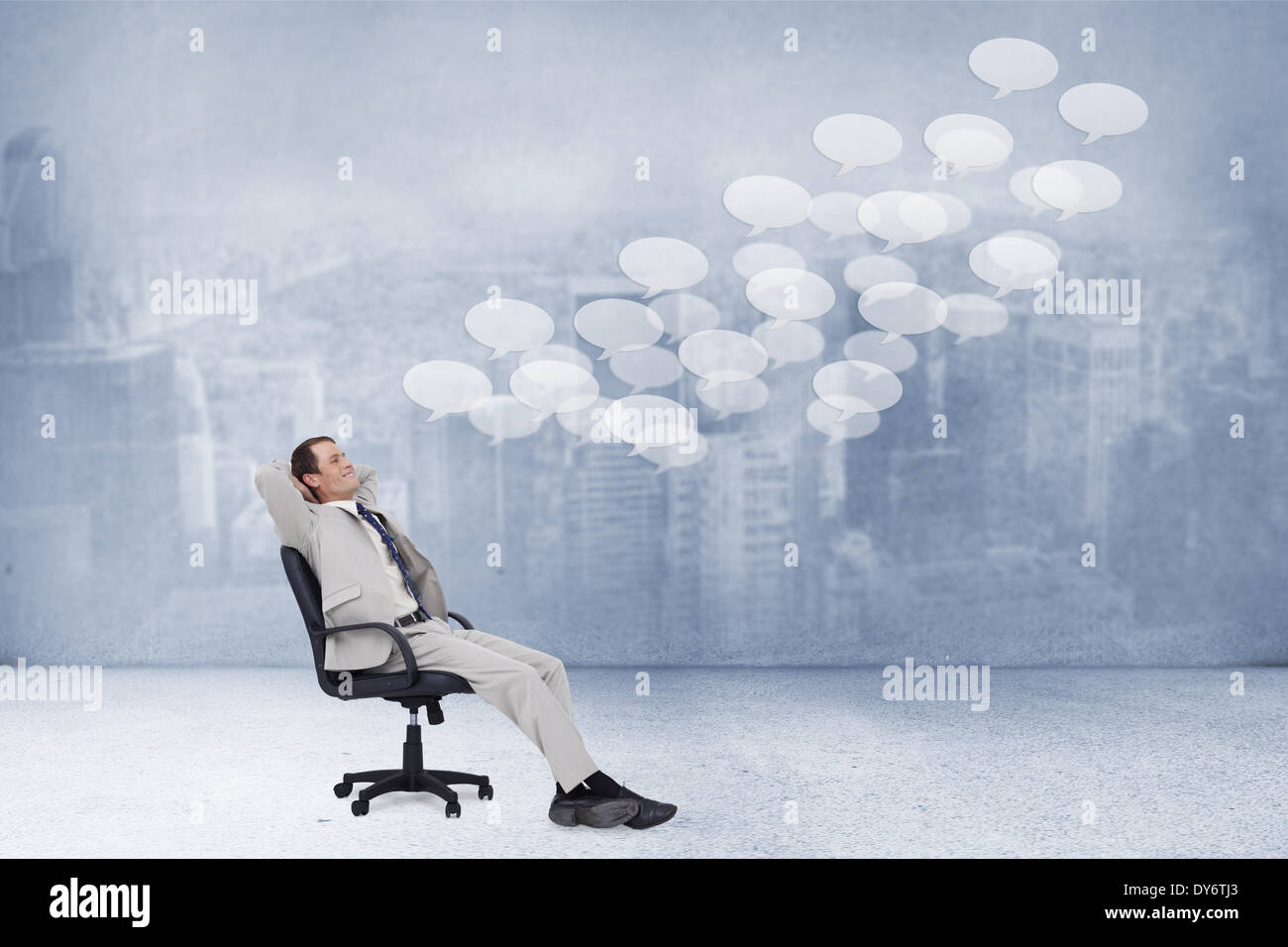 Composite image of side view of businessman leaning back in his chair Stock Photo