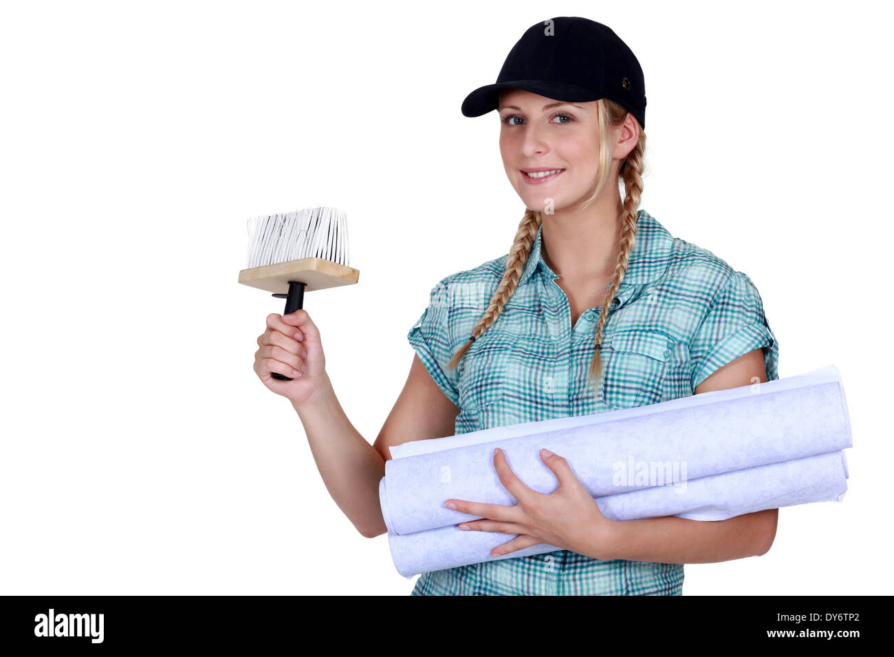 Woman putting up wallpaper Stock Photo Alamy