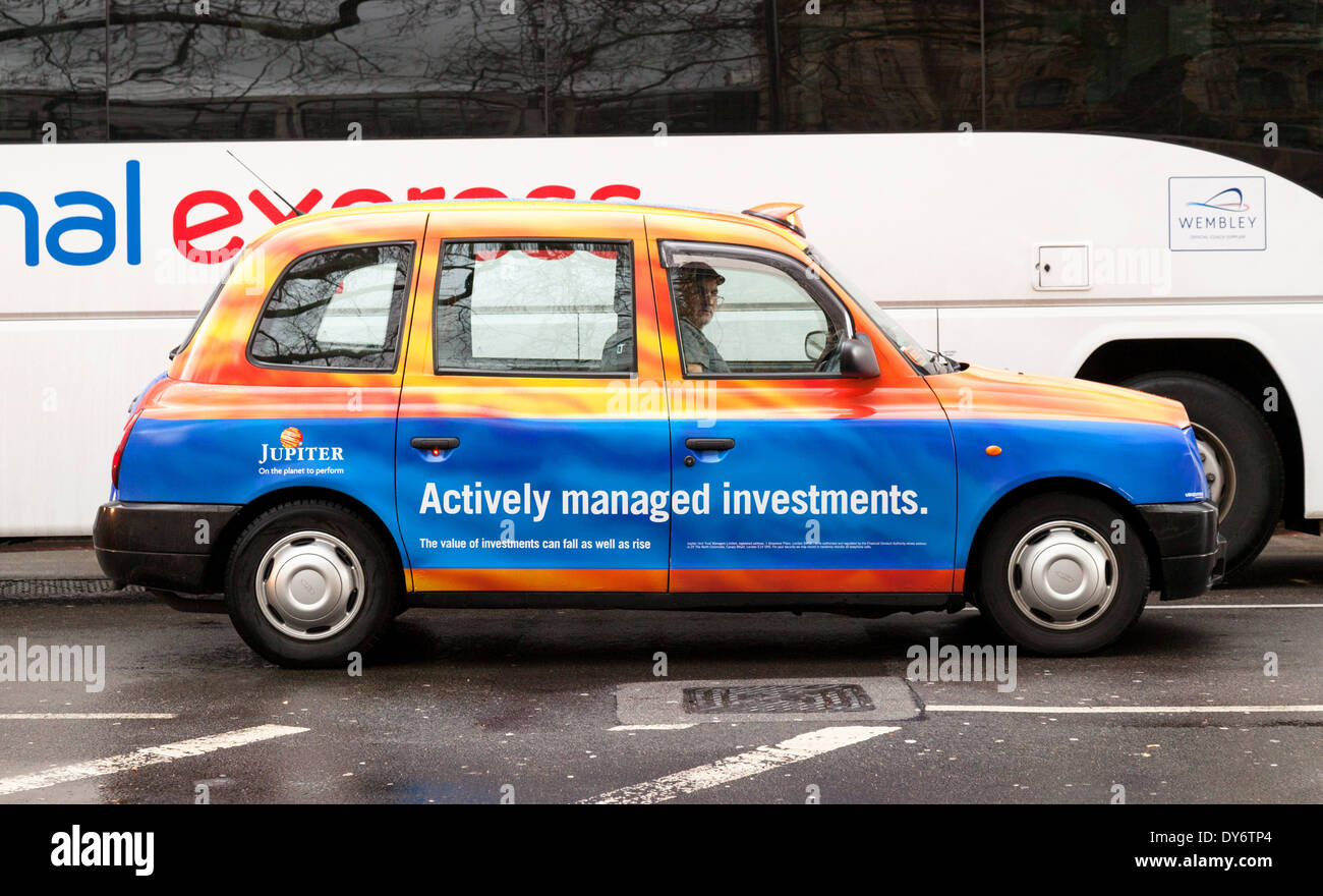 A London taxi advertising Jupiter Asset Management Investment institution, London UK Stock Photo