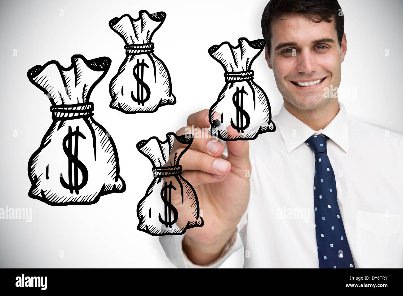 Composite image of businessman drawing money bags Stock Photo
