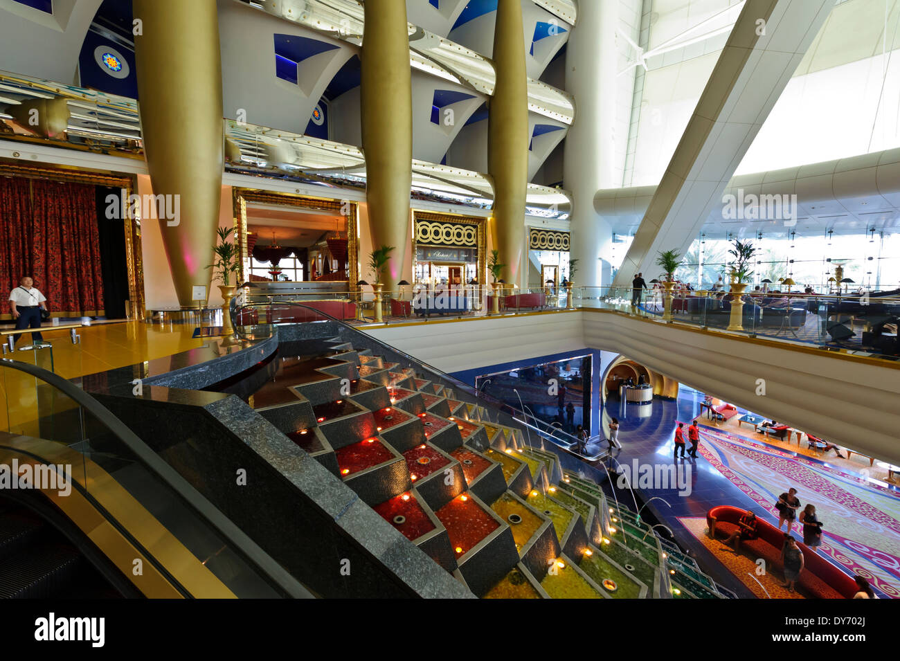 The water fountain leading to the first floor at the Burj Al Arab, classed as one of most luxurious hotels in the world. UAE. Stock Photo