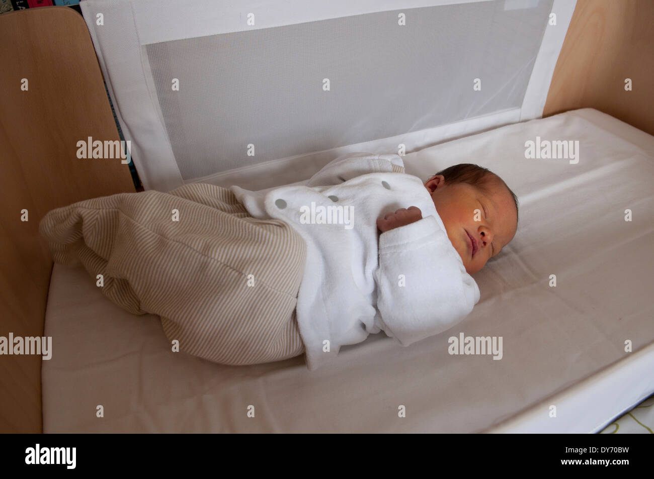 Three day old newborn baby girl asleep in her crib Stock Photo Alamy