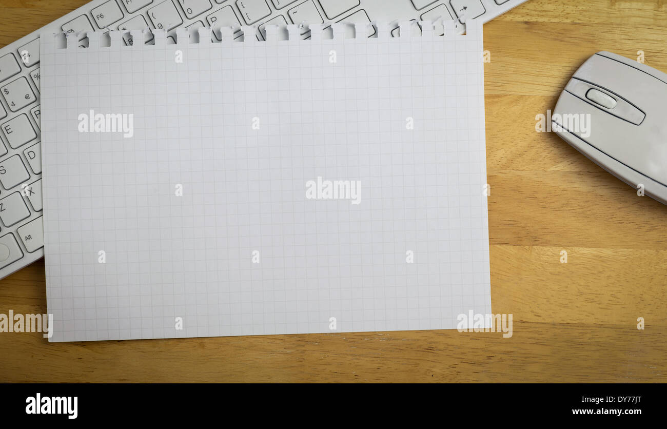Overhead of graph paper on keyboard Stock Photo