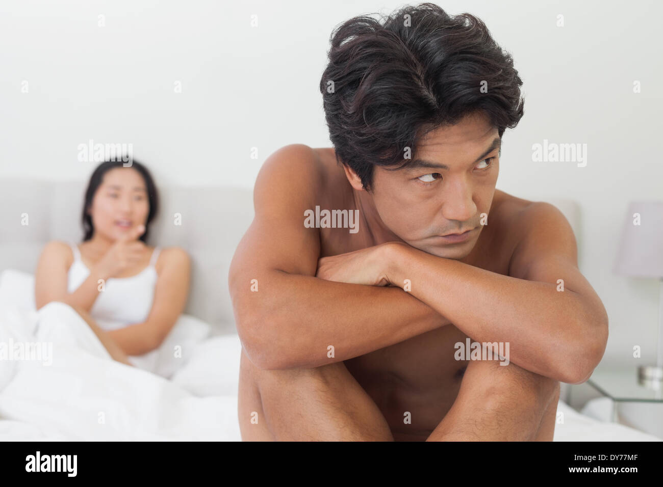 Couple not talking after argument in bed Stock Photo