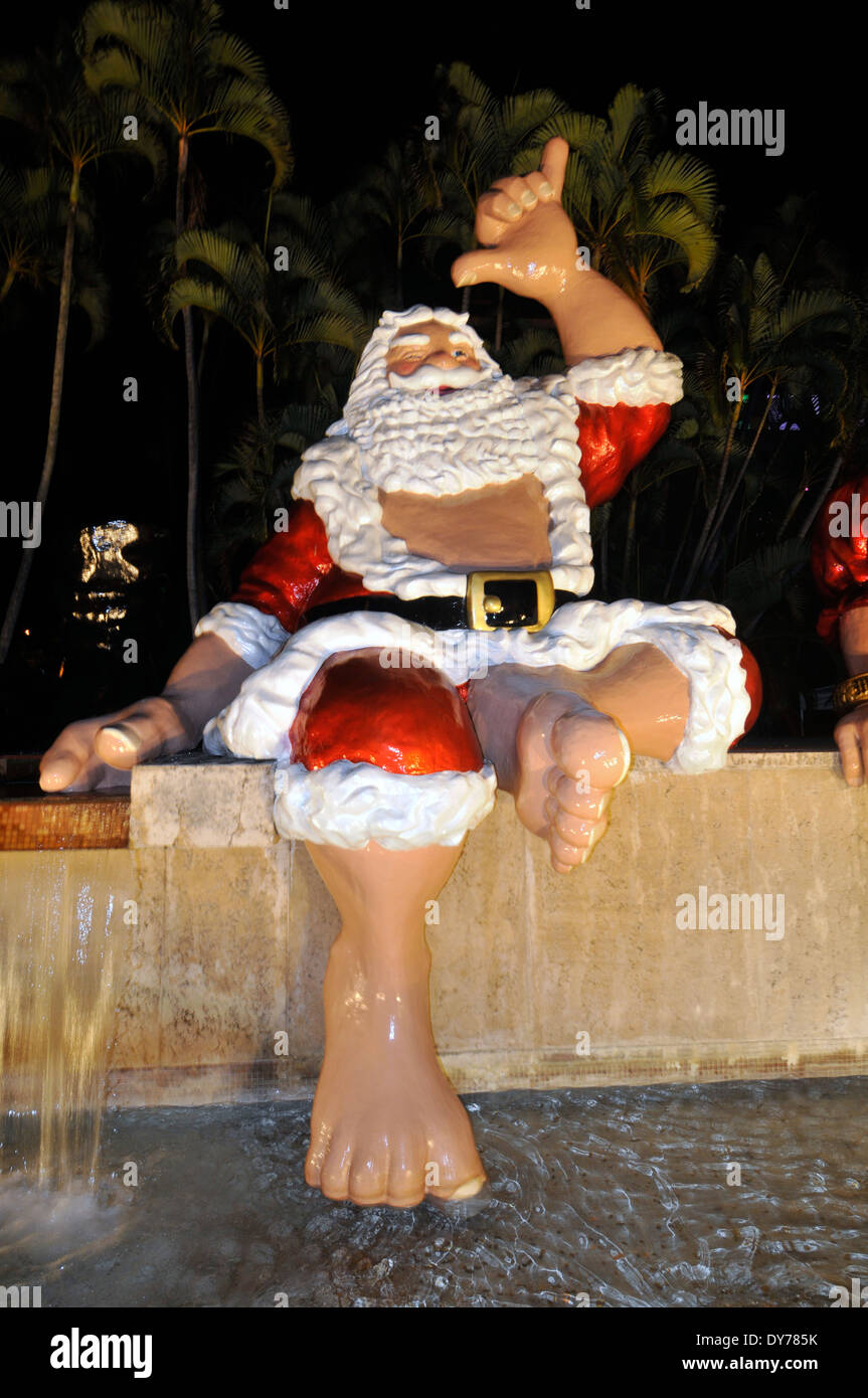 Christmas decoration with traditional Hawaiian characters such as "Shaka Klaus" in Honolulu, Oahu, Hawaii, USA Stock Photo