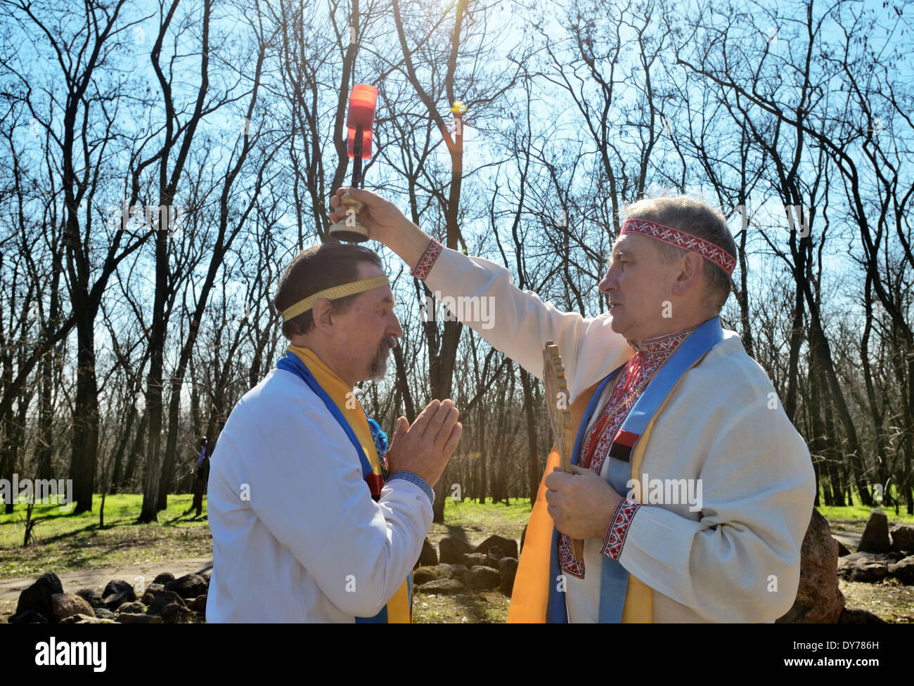 Proto-Slavic pagan rituals in Ukraine. Priests bless each other and ...