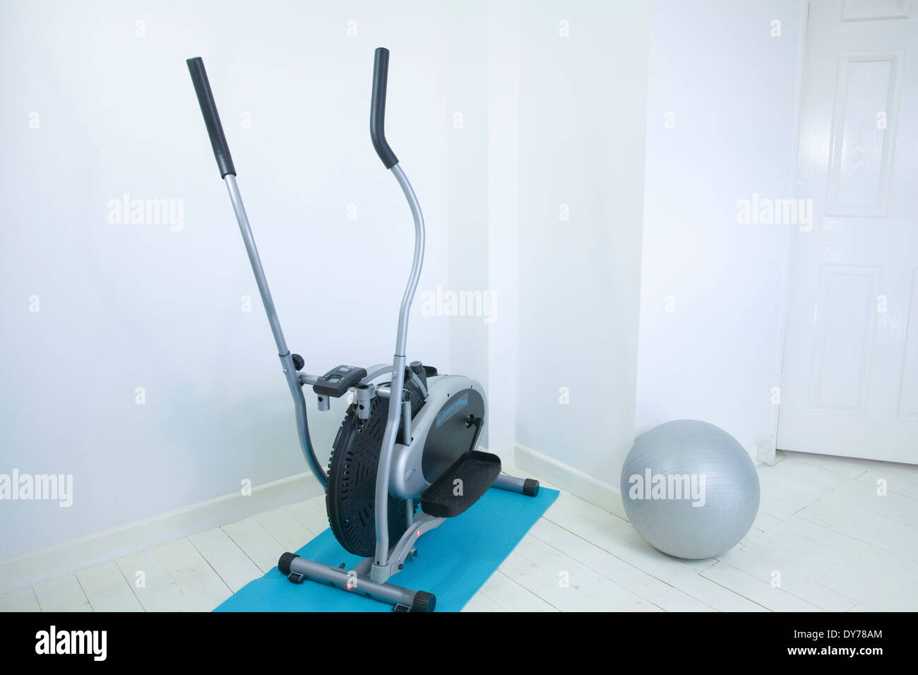 Home Gym with Exercise mat,rubber gym ball and Elliptical trainer Stock