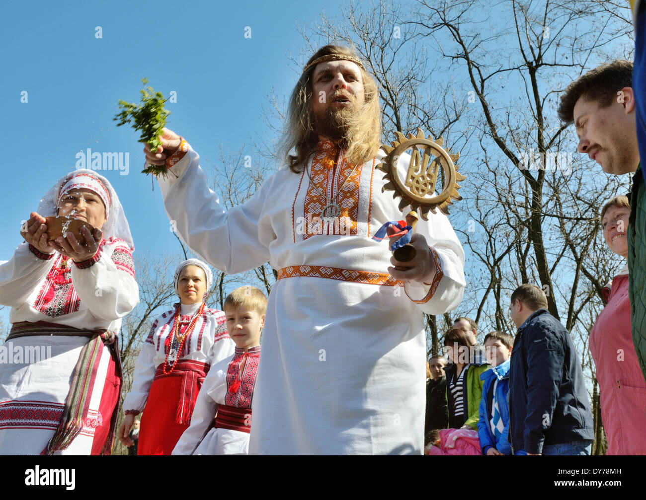 Pagan "Easter" in Ukraine. Priest bless worshipers by water and grass
